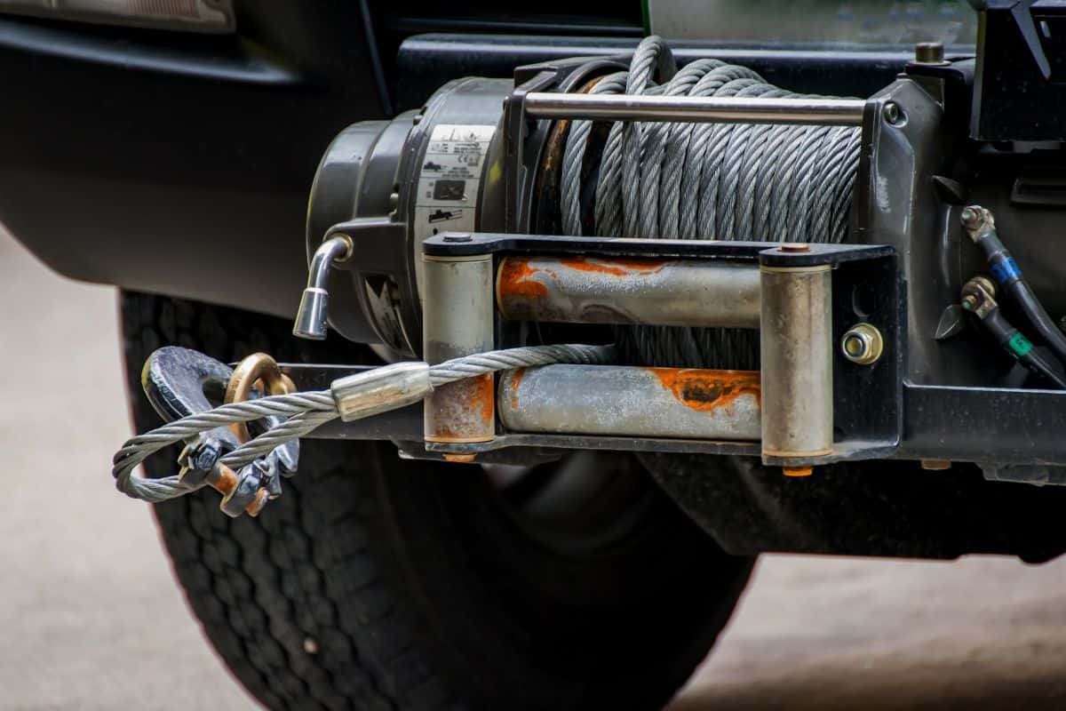 Winch with a cable for self-hauling is installed on a truck or passenger car