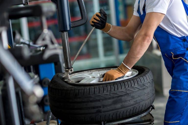 Worker changing the tire for a brand new one, What Are The Biggest Tires For 15 Inch Rims?