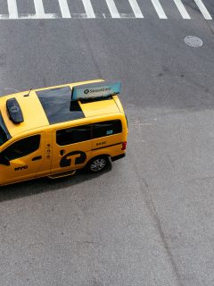 Yellow taxi cab in Manhattan. High angle view. Nissan NV200 is the model of the New York City taxi, Can You Add Seats To Nissan NV200?