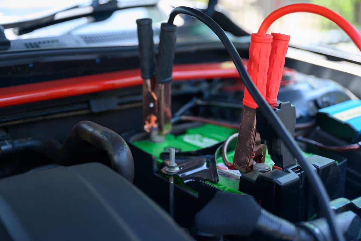 battery jumper cables connect to car battery for charging dead battery
