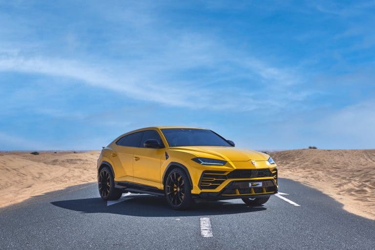 lamborghini urus super car in the dubai desert yellow car, hyper car, How To Cool Down Black Leather Seats [Quickly & Easily]