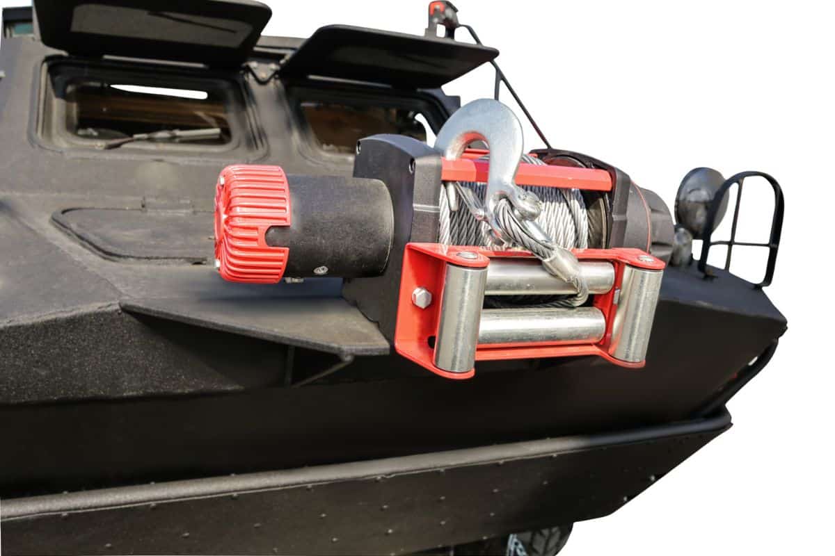 Modern winches significantly increase the permeability of SUV/powerful electric winch mounted on the body of the utility vehicle