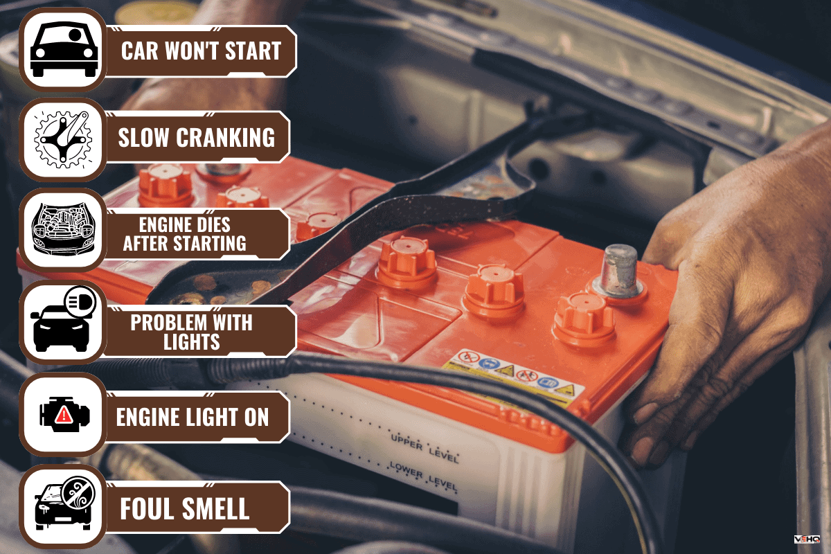 A car mechanic replaces a battery. - My BMW Won't Jump-Start - Why? What To Do?