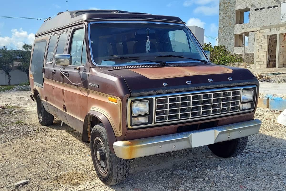 An old Ford Econoline with a Canadian license plate