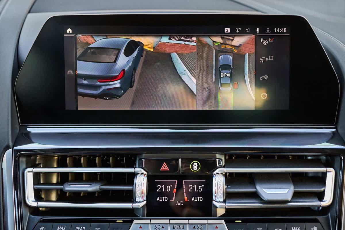BMW 8 Series Interior detail of premium car with rear view 360 surround view camera dynamic trajectory turning lanes and parking assistant redar. Driver assistance system.