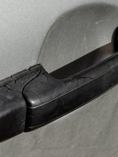 Black plastic handle on the tailgate of a car, How To Open A Tailgate With A Broken Handle [Quickly & Easily]