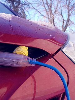 Block heater cable plugged into a vehicle, Oil Pan Heater Vs Block Heater: What's The Difference?
