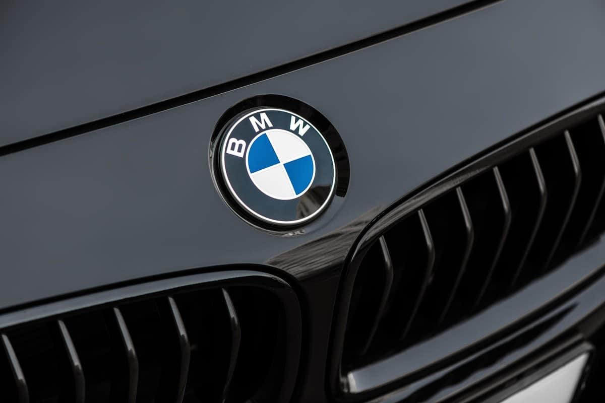 Bmw motor company badge on the front from a black car.