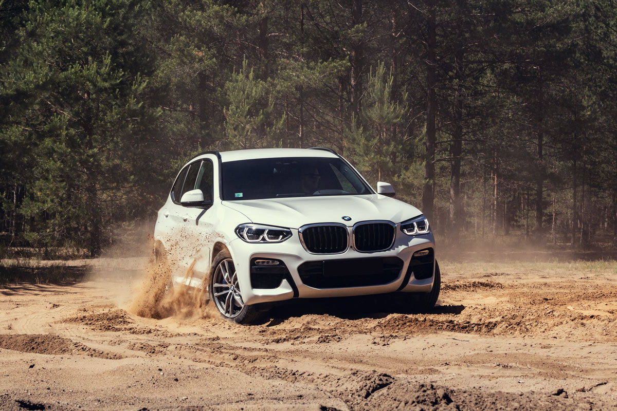 Bmw x3 white color off the road trail sand dusty