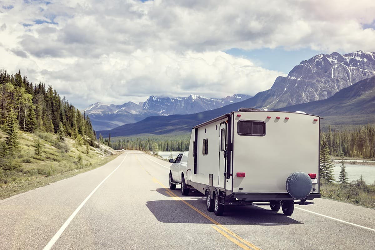 Caravan or recreational vehicle motor home trailer on a mountain road