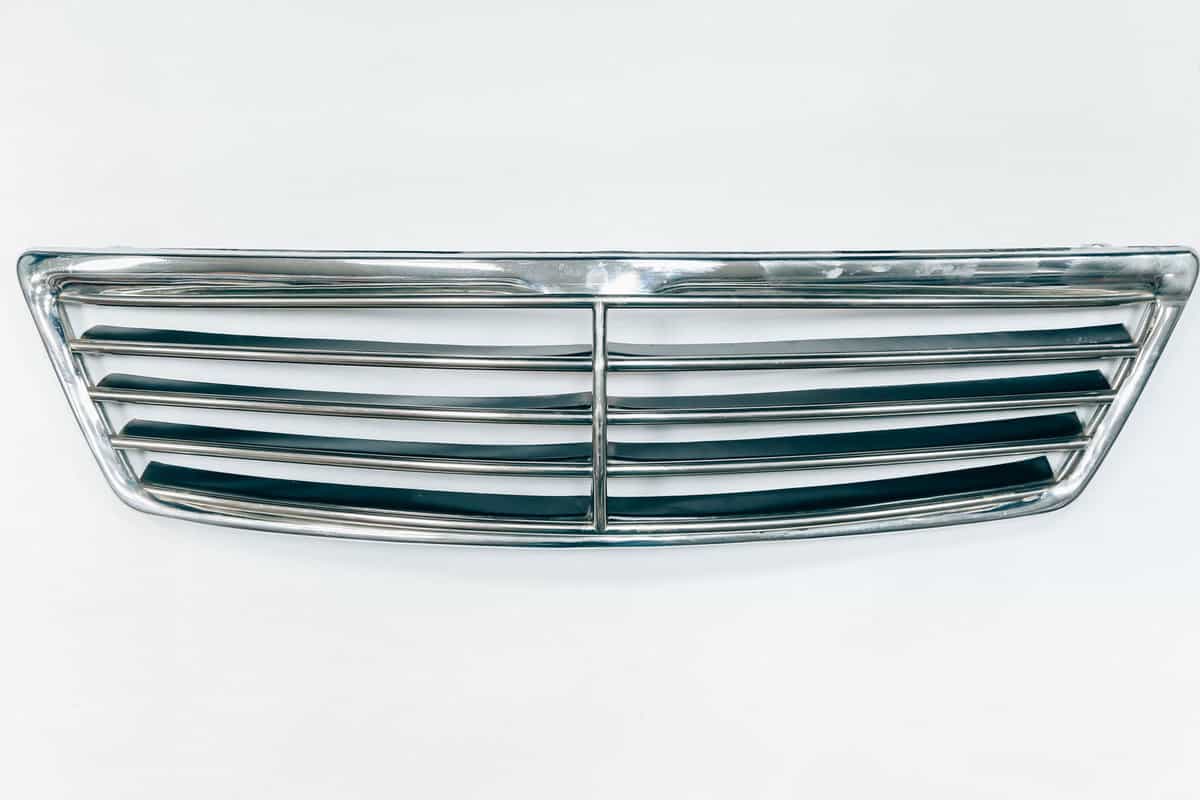 Chrome grille facing the radiator. This part of the car body. 