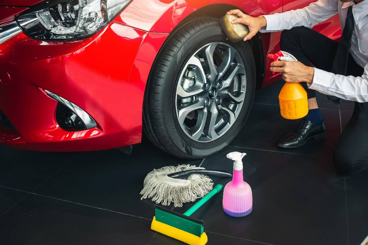 Cleaning a red car wheel