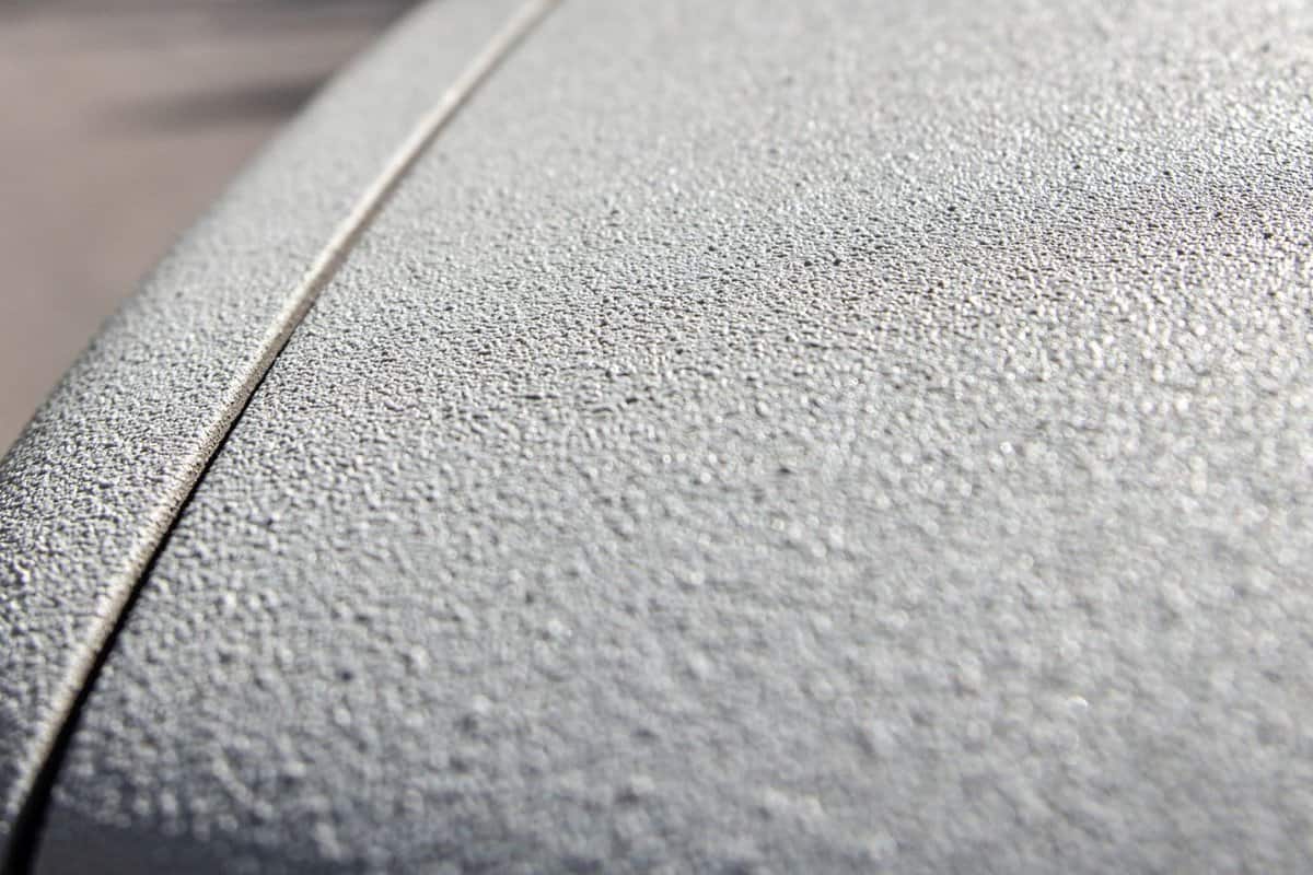 Close-up of a car body coated with the highest strength two-component polymer paint used to protect the bodies of pickups, trucks, trailers.