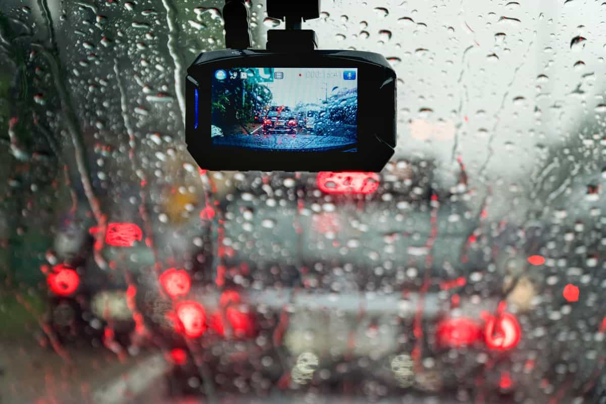 Dash cam recording video despite heavy rain pouring down the windshield
