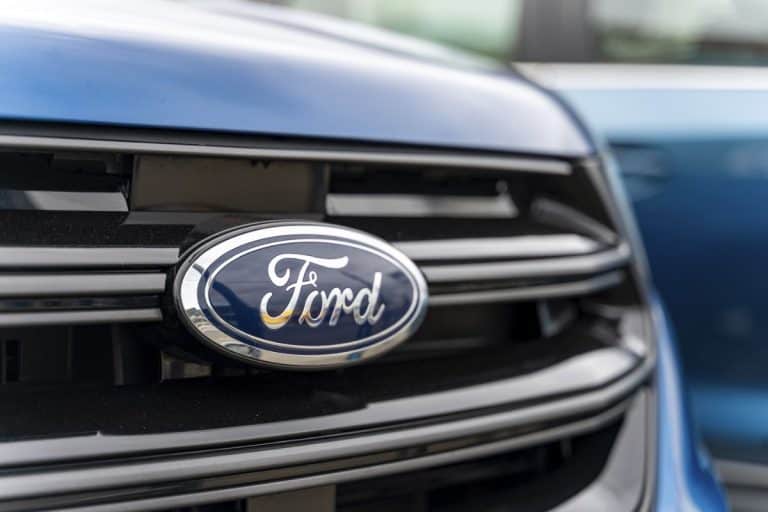 Ford logo on front of a car. Ford is an American multinational automaker that has its main headquarters in Detroit. - How To Remove Ford Emblem From Tailgate [Step-By-Step Guide]