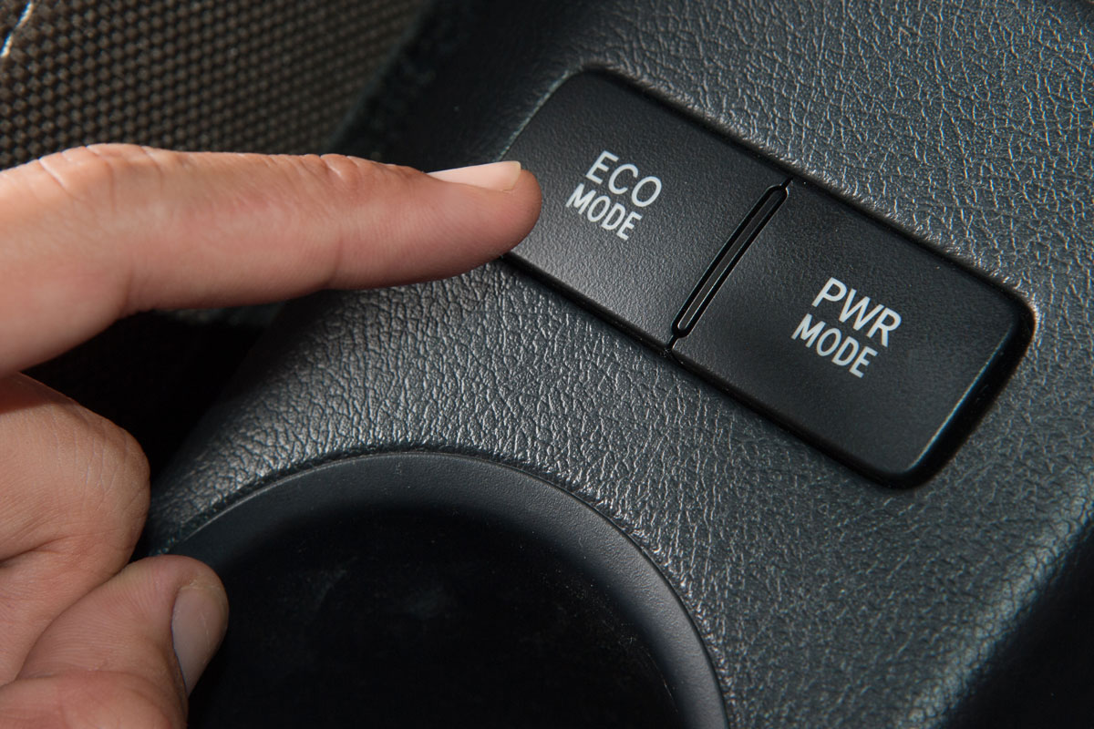 Hand finger press button Eco mode in car