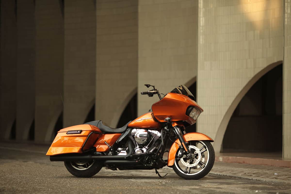 Orange Harley Davidson near the building