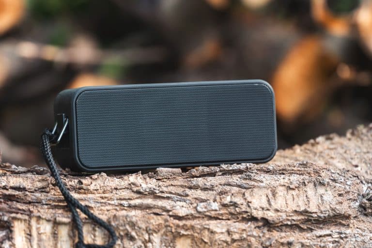 Portable wireless speaker for listening to music on a log, How To Use A Rivian Camp Speaker [Step-By-Step Guide]