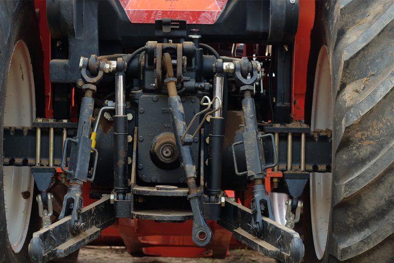 Rear view of new modern red tractor, What Is The Best 3 Point Quick Hitch? [Inc. Cat 1 & Cat 2]