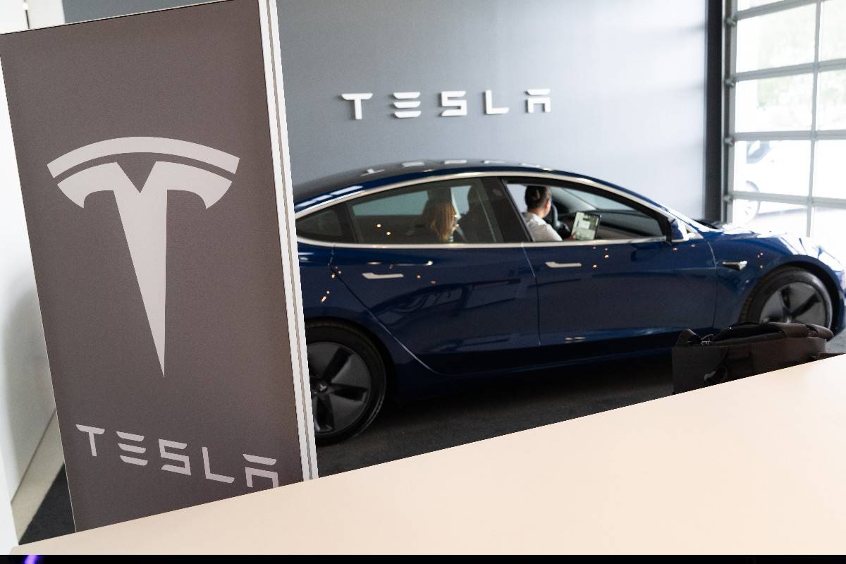 Tesla model 3 electric vehicle at store car