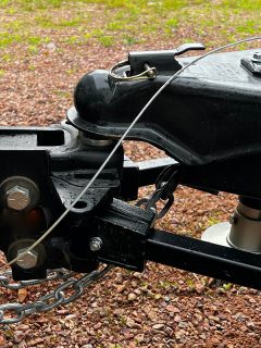 Trailer hitch connected to a truck ball hitch, How Much Weight Does A Weight Distribution Hitch Reduce Tongue?