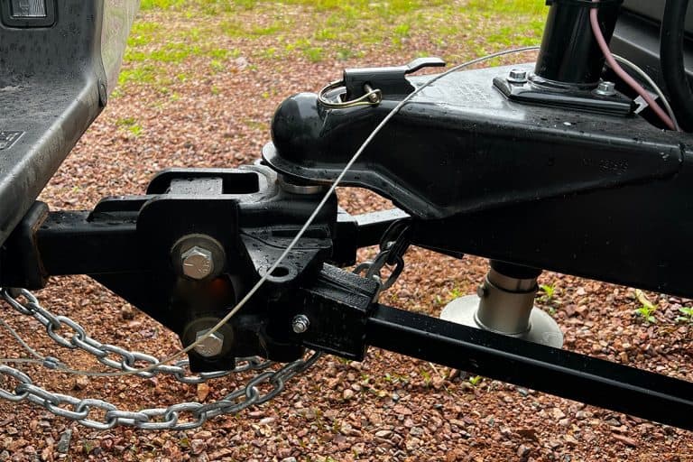 Trailer hitch connected to a truck ball hitch, How Much Weight Does A Weight Distribution Hitch Reduce Tongue?