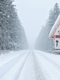 Winter Driving - Heavy snowfall on a country road. Driving on it becomes dangerous. - Can I Use Snow Mode On Icy Roads?