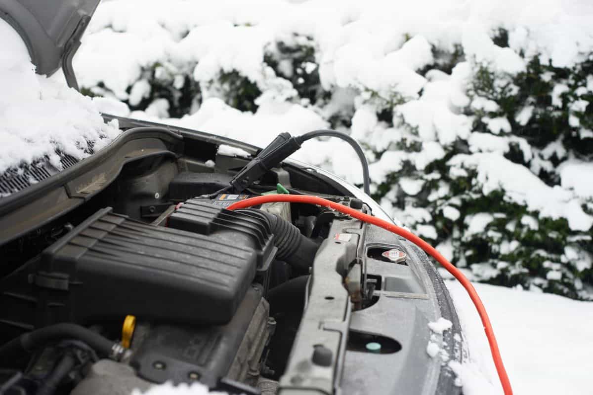 Wires on car battery in snow
