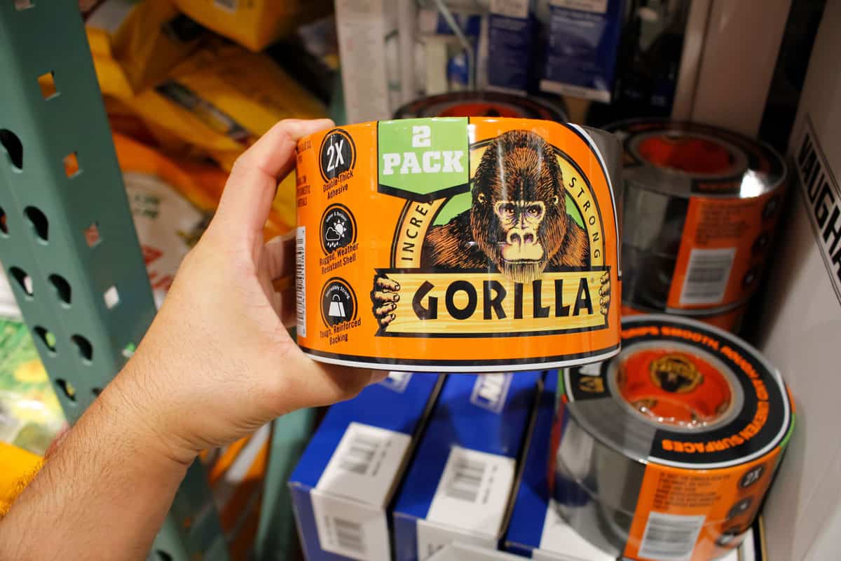 a hand holding a package of Gorilla Tape 2-pack