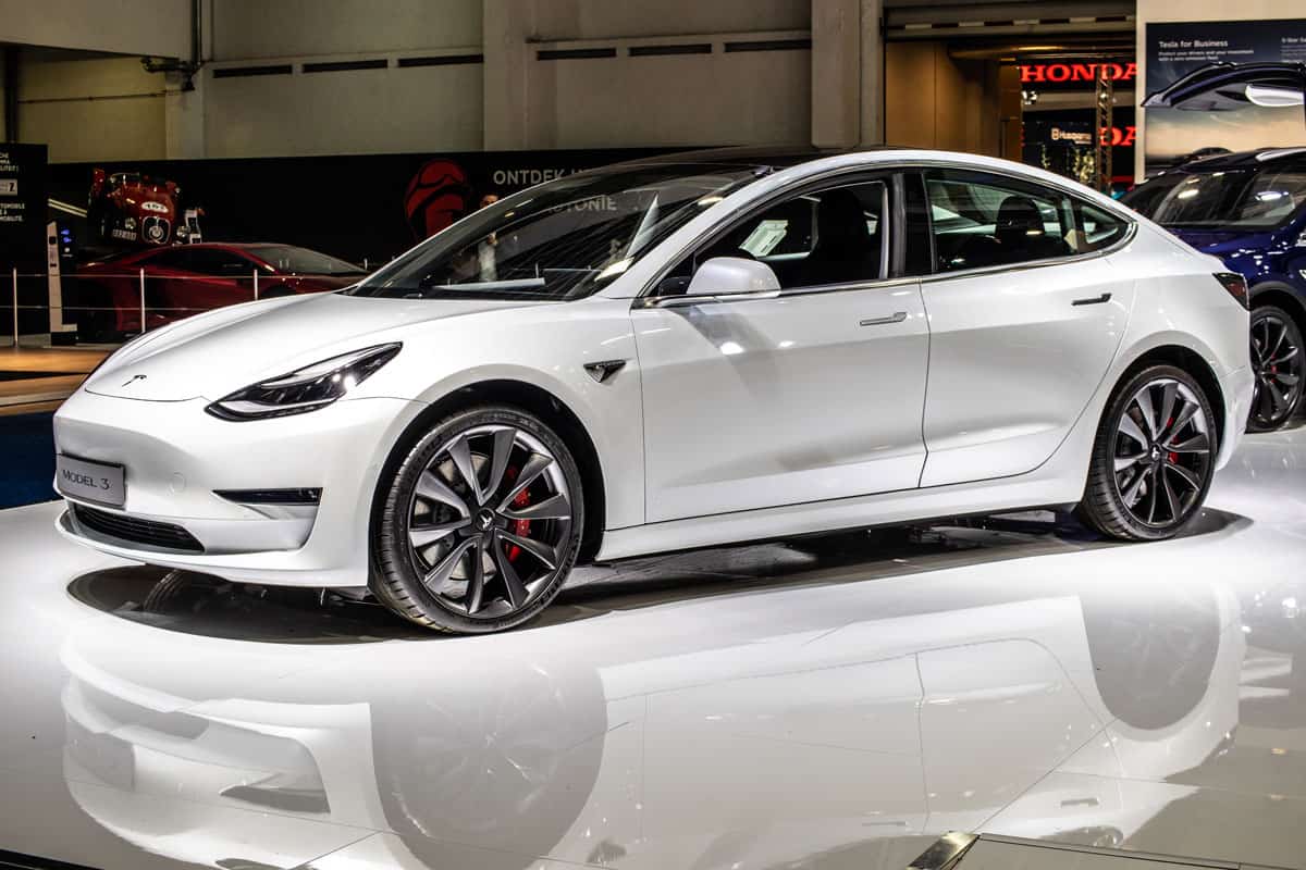 metallic white electric Tesla Model 3 at Brussels Motor Show,