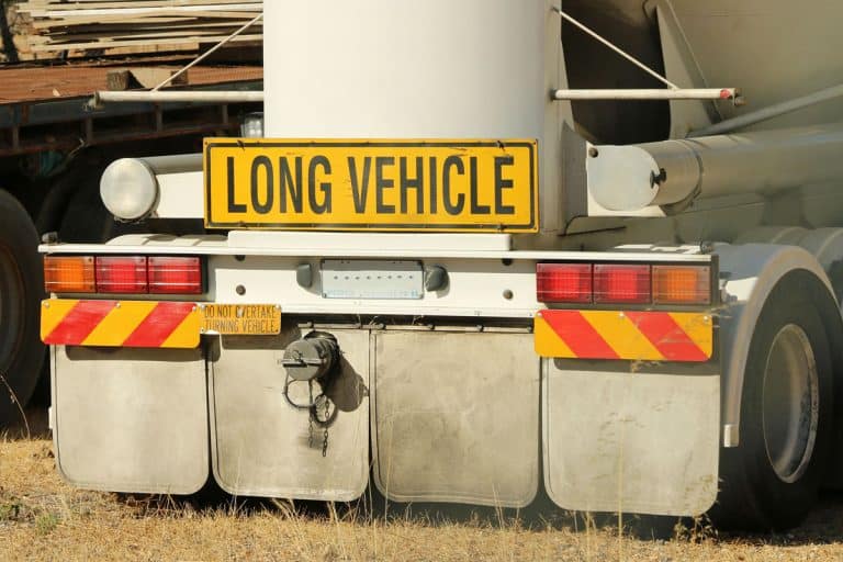 yellow and black long vehicle sign on back of truck, Can You Paint Mud Flaps?