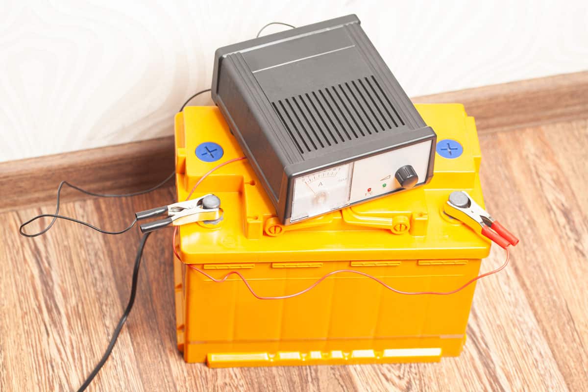 yellow car battery with car battery charger