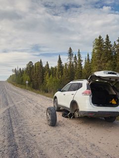 A broken down car on the side of the road, Is It Safe To Jack Up A Car On Gravel?