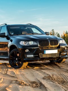 BMW X5 parked on a sandy terrain, Do BMW Batteries Have To Be Programmed?