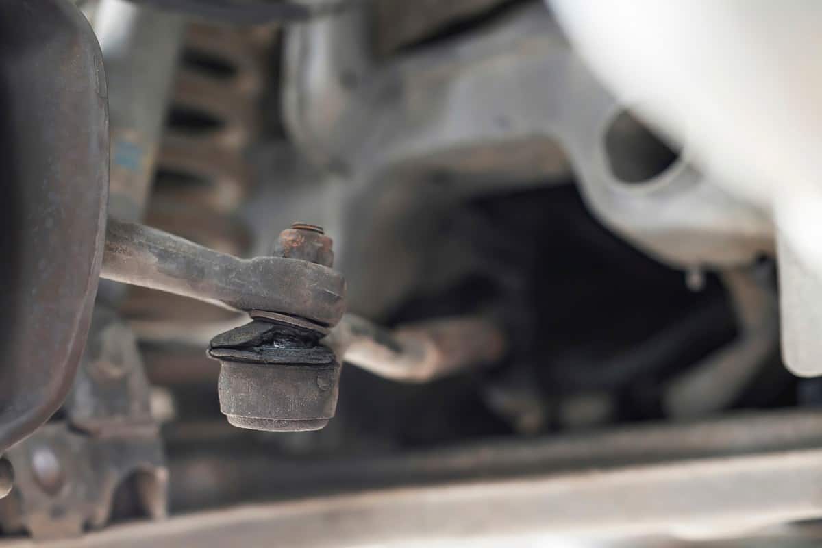 Close-up of damaged links control arm boot ,car suspension.