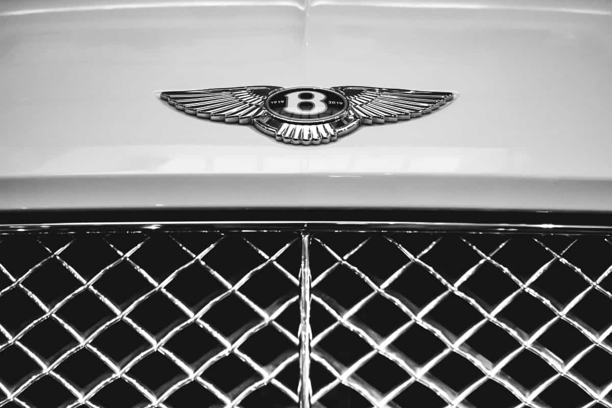 Closed up of Bentley Logo on the front of Bentley Continental car.