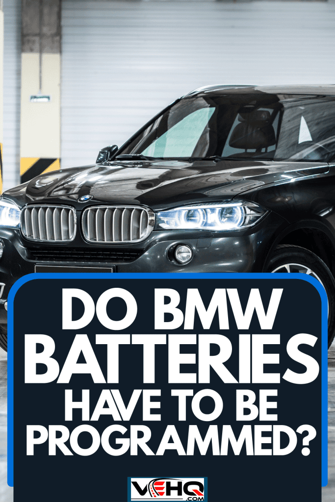 A black BMW X5 parked on a parking lot, Do BMW Batteries Have To Be Programmed?