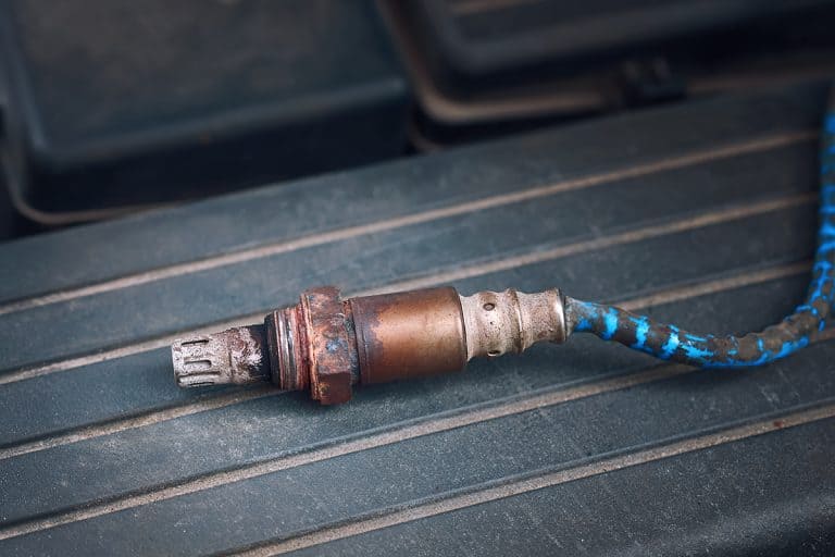 An old and damaged O2 oxygen sensor for replacement, How Long Does It Take To Replace An O2 Sensor On Your Vehicle?