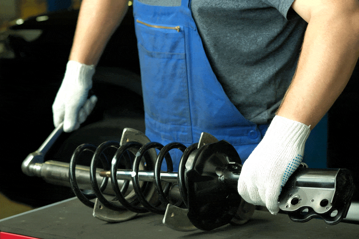 Replacement of the front spring and shock absorber on a passenger car at the service center