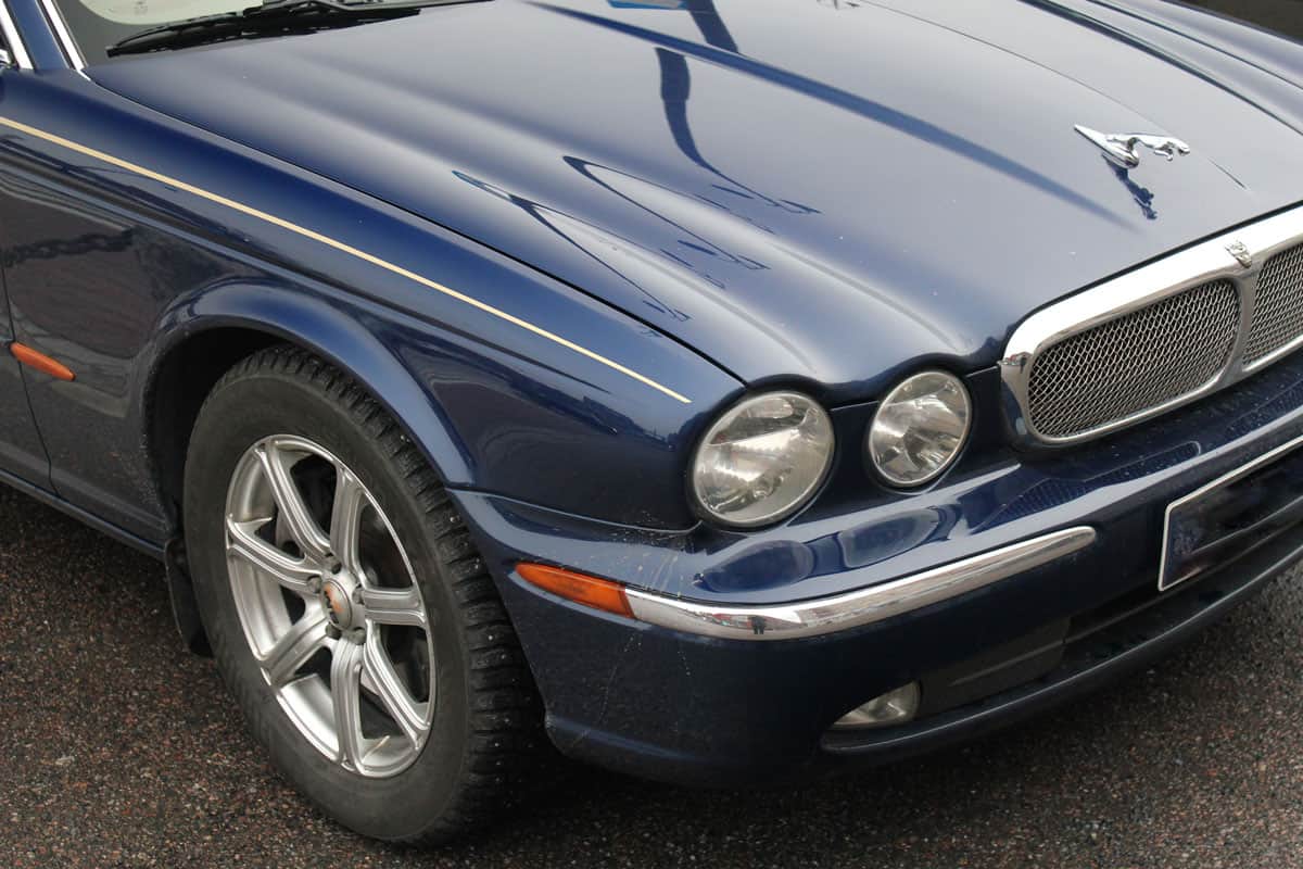 The Jaguar XJ8 Sedan Car Parked In Laukontori square. Jaguar XJ8 Is A Luxury Saloon. The closeup front headlight car.