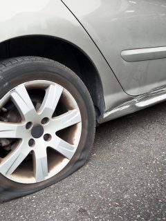 Up close photo of a car flat tire, Can You Get A Flat Tire From Hitting A Curb?