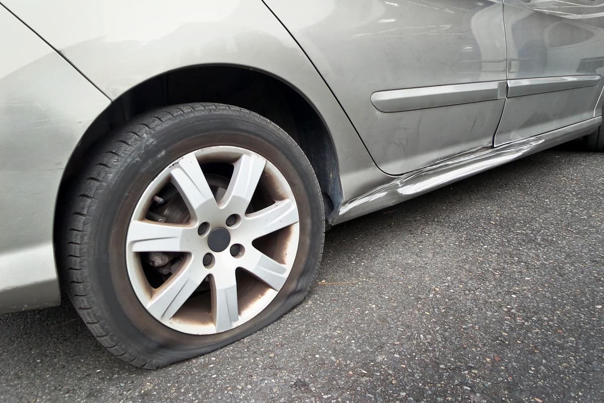 Up close photo of a car flat tire