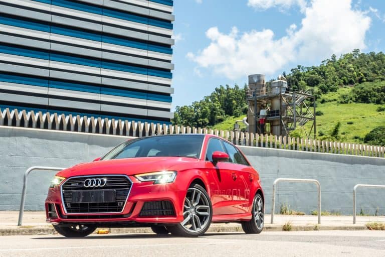 A red colored Audi A3 parked close to a building, Why Is My Audi A3 Burning Oil? Quick Troubleshooting Guide