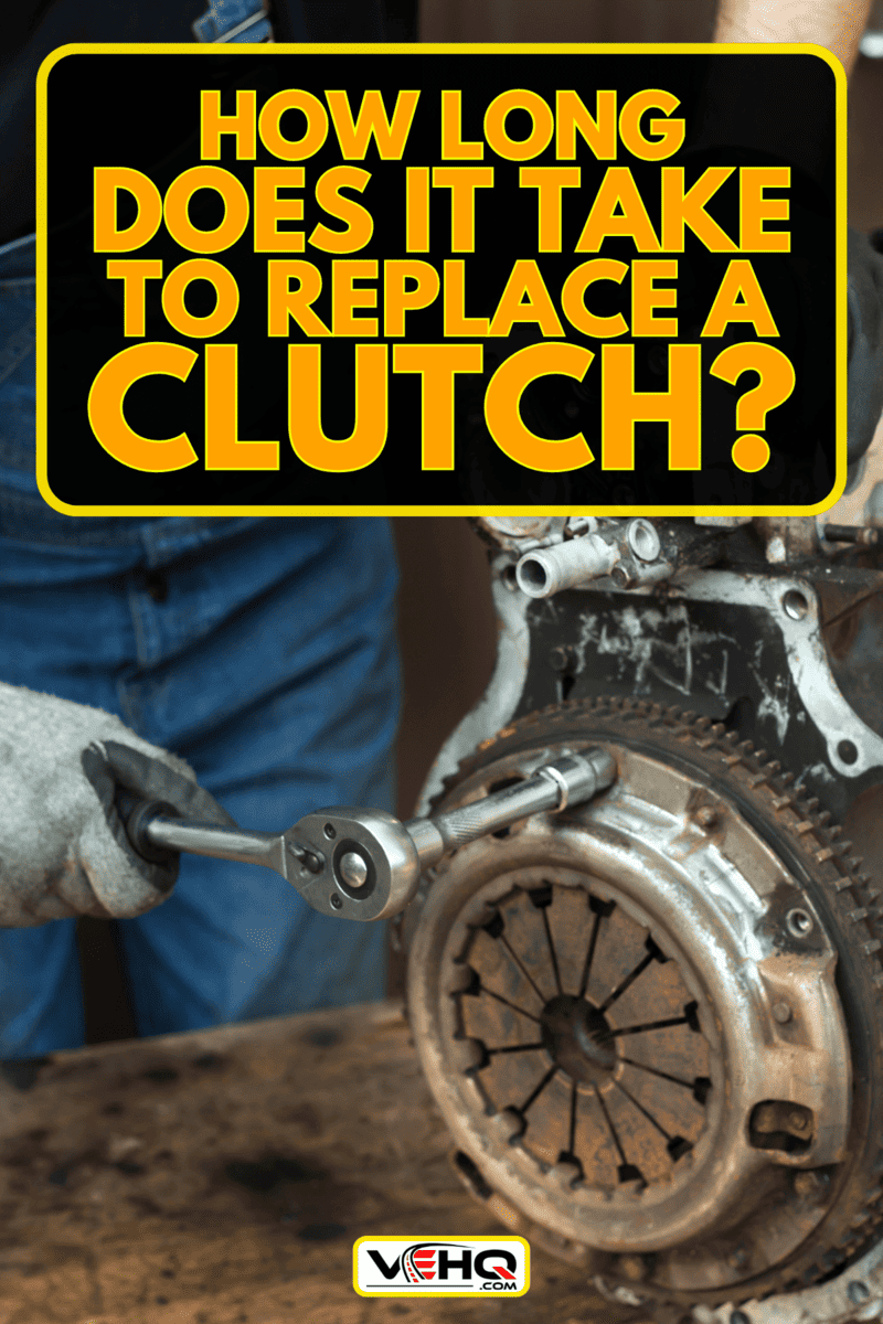 Car mechanic in work gloves unscrews the clutch from the engine block during repair in the workshop, The Ultimate Guide to Clutch Replacement: How Long Does It Really Take?