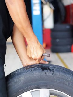 Series of mechanic patching puncture tubeless tire. Plugs being inserted into punctured area. - Can You Plug A Tire In The Groove? Debunking Myths & Quick Fixes