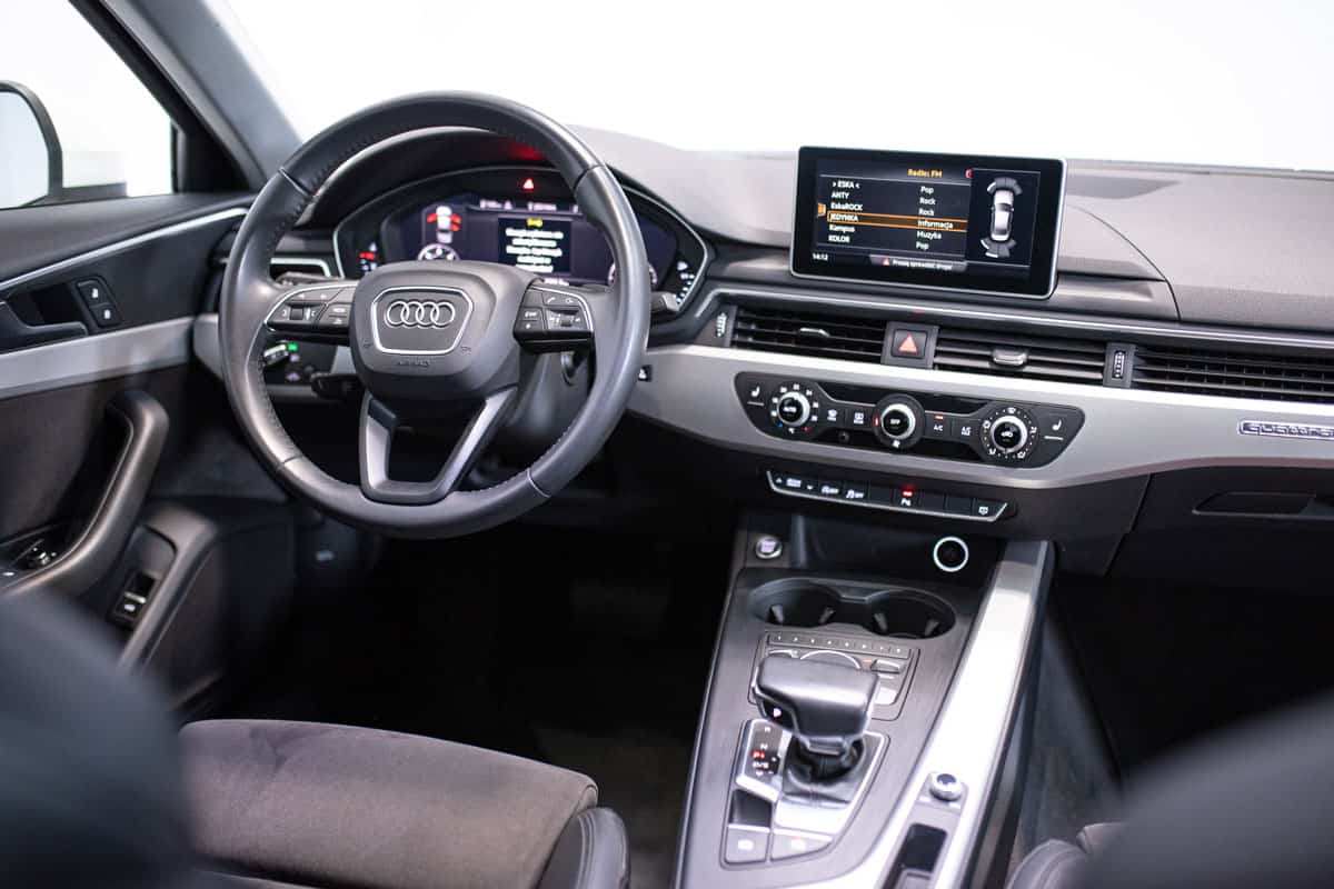 Interior of an Audi A4 with leather seats and dashboard