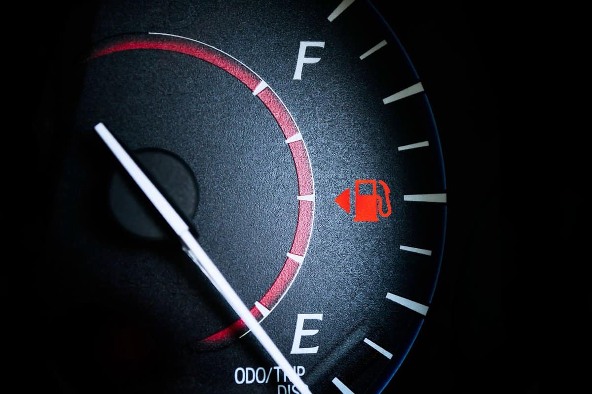 Fuel Gauge Showing Almost Empty,Time for another very expensive fuel purchase. Red warning icon light door.
