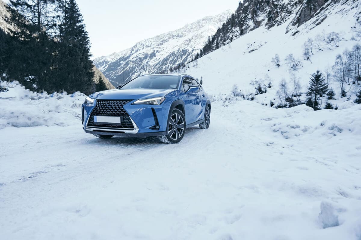  New   Lexus UX 250h. New luxury car concept. Blue hybrid car on the road side in snow and dangerous icy conditions.