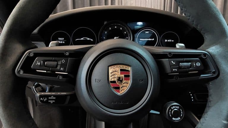 Porsche 911 Carrera S 2022 car interior cockpit steering wheel car seats dashboard Center console indoor no people inside car dealership. - My Start-Stop Mode is Deactivated On My Porsche - Why? What to Do