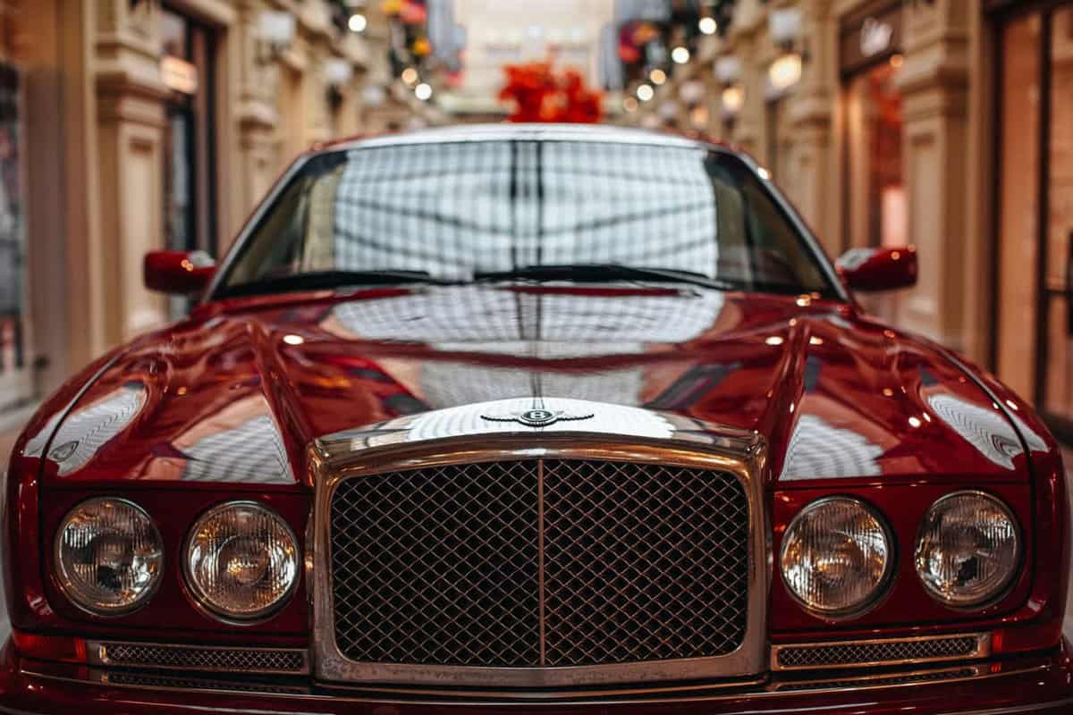 he details of a red Bentley famous vintage car. Luxury Automobile Store Bentley in Moscow.